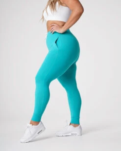 High-Waisted Turquoise Joggers with Tapered Cuffed Ankles 6 High-Waisted Turquoise Joggers with Tapered Cuffed Ankles -NVGTN Sportswear Shop DSC00395